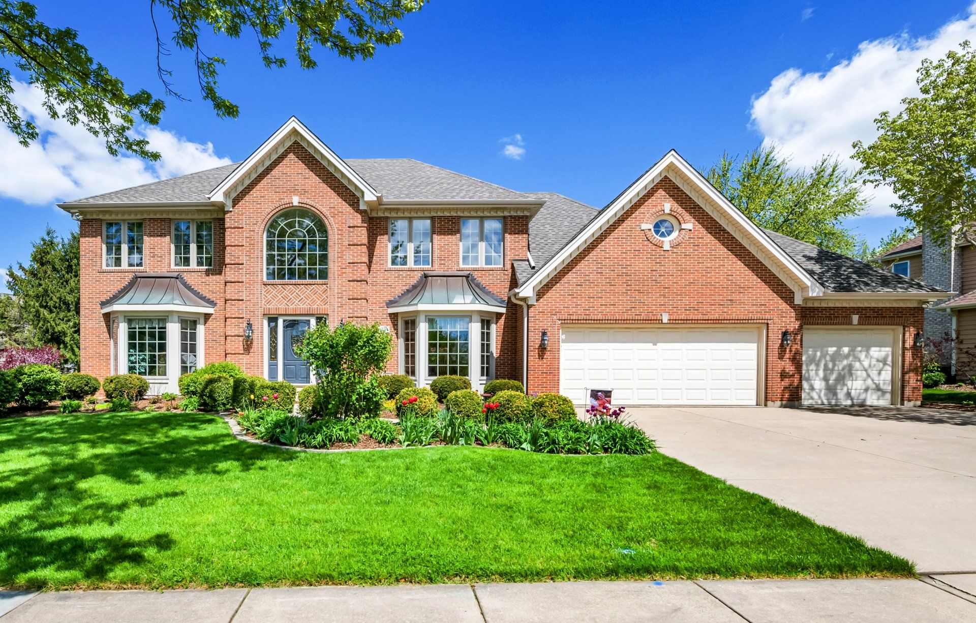Brick house with green lawn